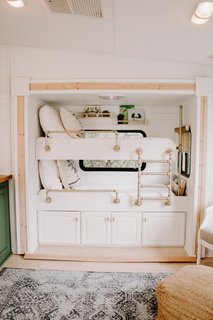 To maximize space, they added bunk beds to an area that was previously a slide-out entertainment center, and also included storage underneath. 