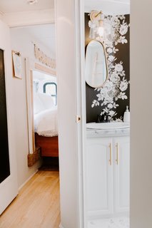"The bathroom may have been my favorite transformation," explains Lauren. "I spotted some beautiful inspiration from Studio McGee and I was hooked on the floral wallpaper idea."