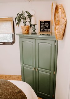 "We decided to bring the kale-green shade from the kitchen into the bedroom by painting the wardrobe green," adds Lauren.