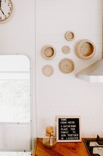The custom-built kitchen was made from hardwood flooring material. Now, this area serves as a gathering place for families to join together.