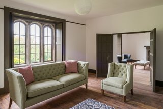 The double doors between two reception rooms open to create a double living space that is ideal for large gatherings.