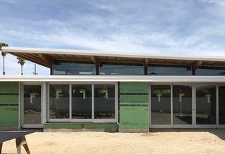 Doors by Marvin Windows and Doors will lift and slide into hidden pockets in the walls, allowing rooms of the house to open dramatically to the courtyard. 