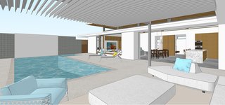 The L-shaped house wraps around a courtyard with a pool and patio, connecting the indoors to the outdoors.