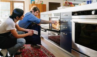 Lefebvre loads the water container into the steam oven. The Fisher & Paykel Built-In Combination Steam Oven is easy to install and doesn’t require any plumbing. It can be installed nearly anywhere to suit your preferences and kitchen design.