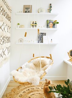 A window nook in the Crosby Loft allows for a small seating area and a vignette for the owner's collection of small tchotchkes. BC-OA's renovation took into consideration the clients' wish to embrace the imperfections of the loft's original features.