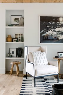 Sunny days can be spent lazing on CFC chairs. Cartwright made sure that the rug and pillows were of a similar style in order to keep the room orderly and focused.