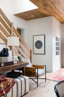 The entryway serves as the most welcoming spot in the home, with a multitude of textures lending a homely feel.