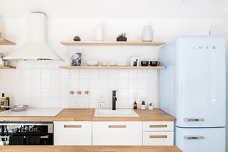 Every fully-furnished apartment comes equipped with a private patio and a high-spec kitchen with a retro Smeg refrigerator. Hi-speed WiFi, Google Home, air conditioning, an in-unit washer/dryer, and utilities are all included.
