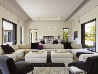 "We did not want a lot of bold colors in the art to distract," says Hill. The artwork was purposefully chosen to blend in with the furniture, rather than stand out.