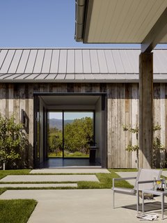 The three attached structures house an office, guest suite, and game room, used by the family to watch football games.