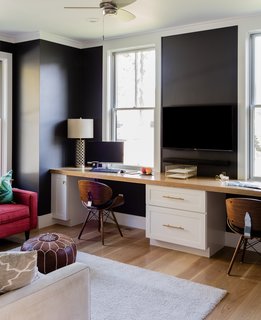 "The first floor has a separate home office were we flipped the exterior color palette by painting the walls black and the windows white," says Hawthorn Builders.