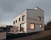 Modern home with Exterior, Wood Siding Material, House Building Type, Shed RoofLine, and Metal Roof Material. Front Photo 11 of Semi detached house on a hillside