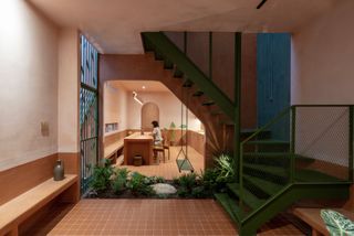 Wall to Wall Clay—Including Animal-Shaped Doorknobs—Recasts This Vietnamese Tube House