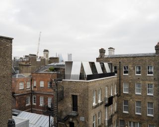 An Eye-Catching Aluminum Pavilion Tops This Renovated London Penthouse