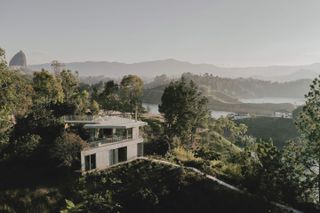 Stacked Geometric Shapes Form a Hillside Concrete Home in Colombia