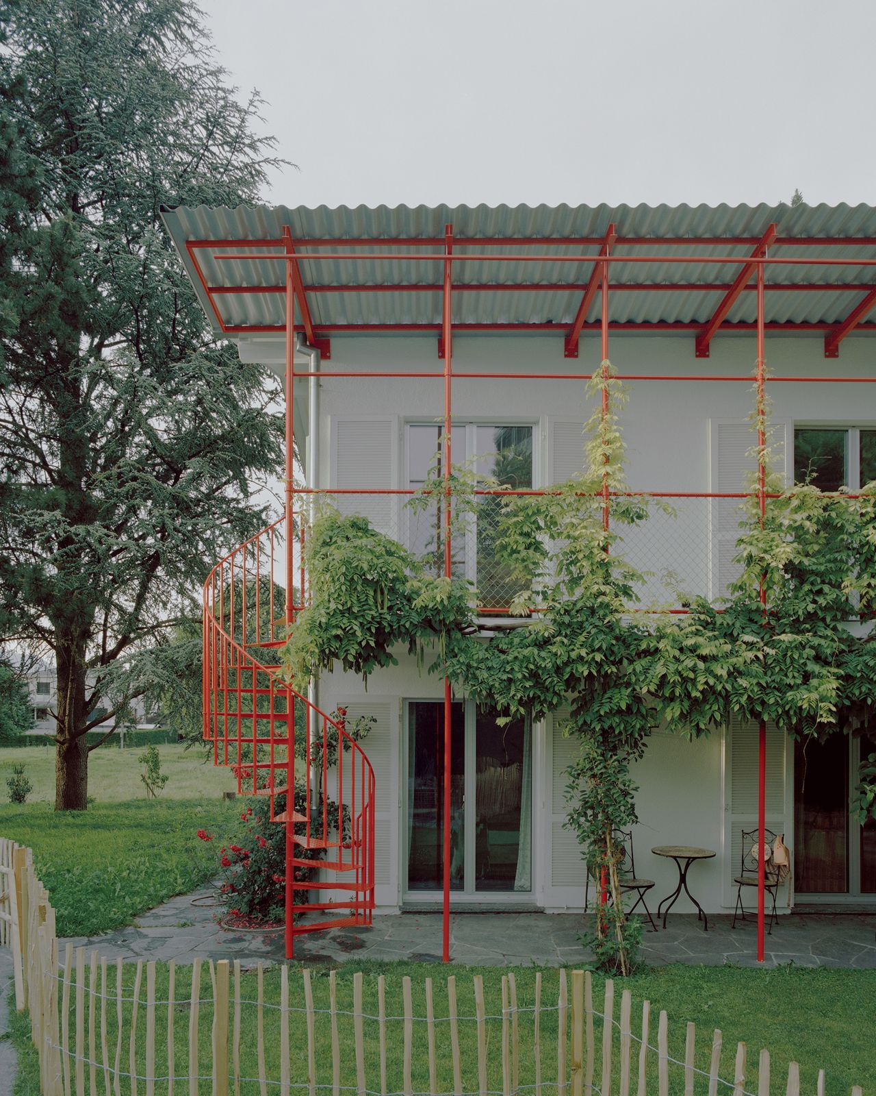 Red Piping Punches Up a Liechtenstein Home Split Into Two Units