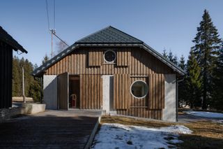 A Fiber-Cement Structure Forms the Interiors of This 19th-Century Czech Cottage