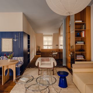 Seating, Shelving, and Spatial Definition—a Blue Box Does It All at This Refreshed Berlin Flat