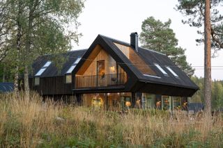 The Roof at This Norwegian Retreat Holds a Surprisingly Roomy Second Level