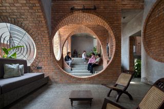 Brick Portals Channel Light and Air in This Multigenerational Home in India