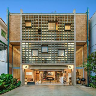 Massive Concrete Screens Bring Plenty of Light and Air to This Sandwiched-In Brazilian Home