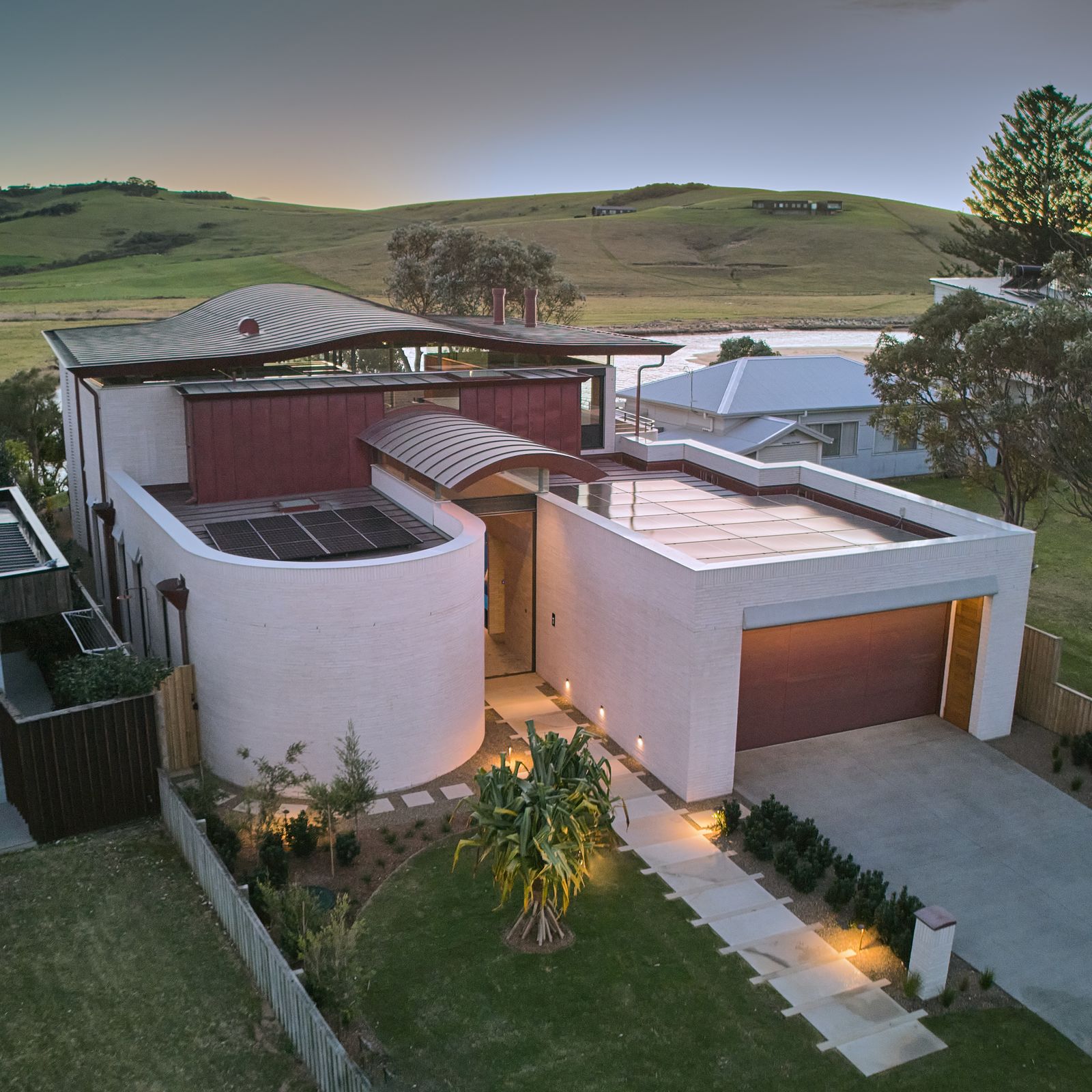 Photo 1 of 15 in Like a Hat, a Wavy Roof Caps This Beach House in…