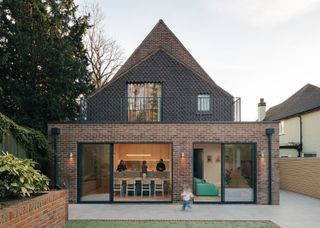The Kitchen Island Is Also a Bench Seat at This Expanded Family Home in London