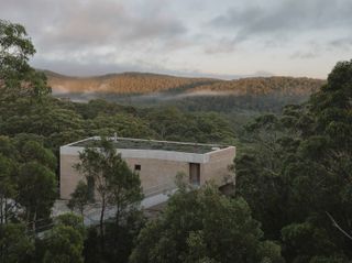 At an Australian Home Built Into a Cliff, You Enter Via the Footbridge
