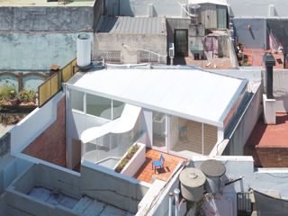 A Translucent Exterior Stair Reorganizes This 1950s "Propiedad Horizontal" in Buenos Aires