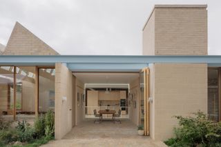 A Sawtooth Roof With Skylights Caps the Living Space of This Melbourne Home