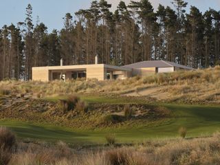 Floor-to-Ceiling Glass Sliders Peel Back Entire Walls at This Rammed Earth Home in New Zealand