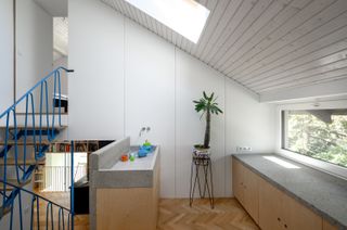 In Slovenia, Two 1950s Terrace Homes Trade Tiny Rooms for Light-Filled Vertical Layouts