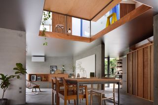 A Ceiling Cutout Above the Dining Area in This Kyoto Home Doubles as a Desk