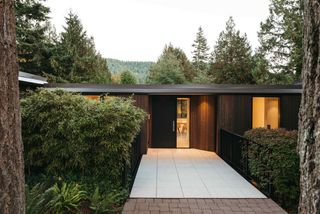 Tall Trees Surround This $3.6M Mountainside Midcentury Near Vancouver